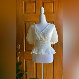 ASTR Beautifl white short sleeve top with ruched detailing around waist.
